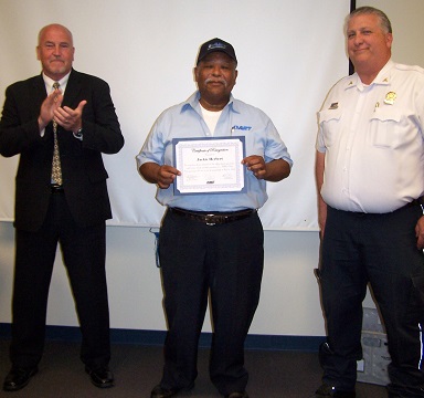 Mr. Jackie Herbert was awarded one of the first awards in May, 2014, for helping to save the life of a bus passenger in cardiac arrest.  He's pictured with Sean Finerty and Deputy Chief Mark Allston of the New Castle County paramedics.