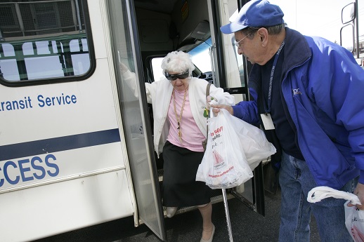 Senior shopper driver assisting